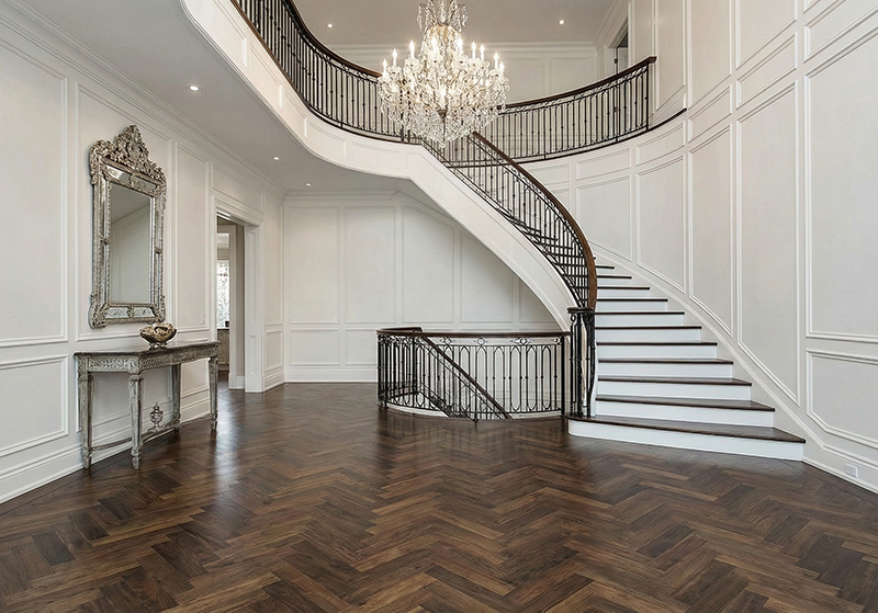 This second image showcases a classic and elegant dark walnut floor laid in a herringbone pattern. This intricate style is a hallmark of high-end design and adds a sense of grandeur to the foyer.